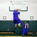 Ypsilanti graduate LaVonte Davis takes a picture as Chance Luker grabs a basketball rim after commencement at the Convocation Center at Eastern Michigan University on Tuesday, June 4. This is the 164th and final graduating class for Willow Run High School. Daniel Brenner I AnnArbor.com